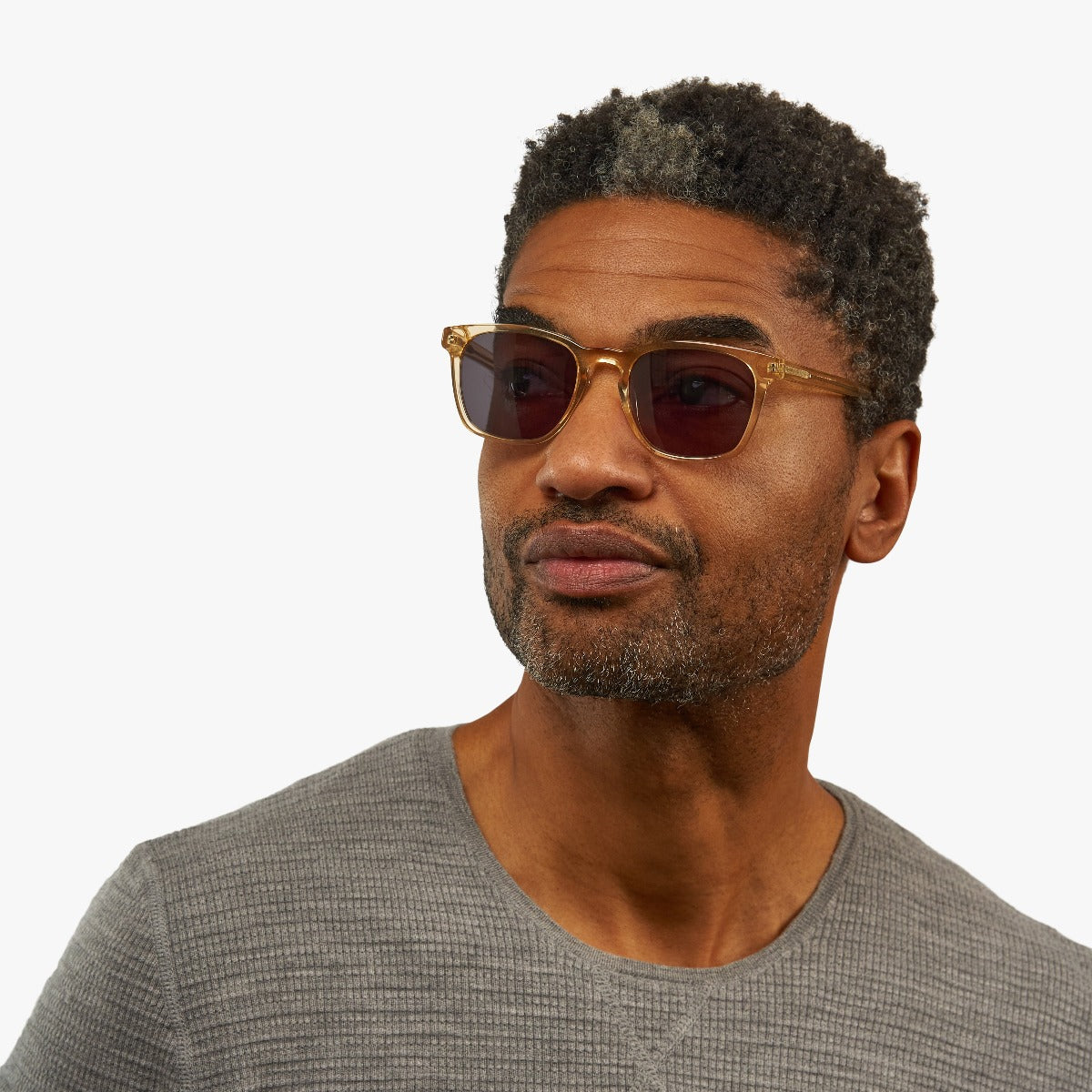 Person wearing Bornholm Crystal Lemon sunglasses with gold frames