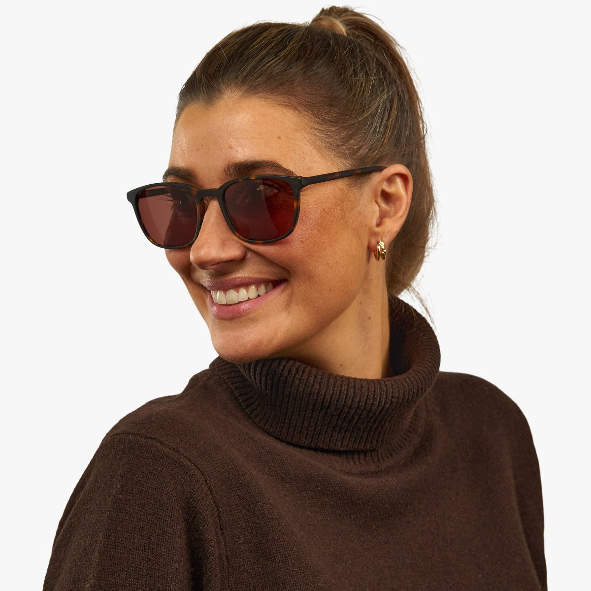 Person wearing Ebeltoft Dark Turtle sunglasses with dark lenses