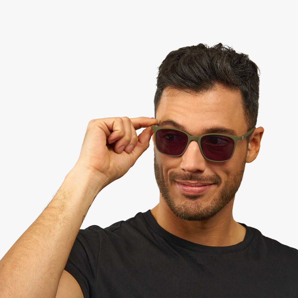 Person wearing Fyn Dark Army sunglasses with green frame