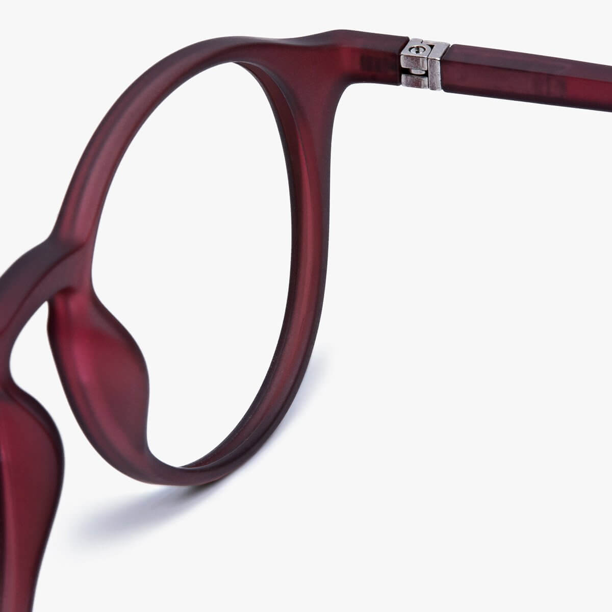 Close-up of Læsø Red reading glasses with a sleek matte burgundy frame