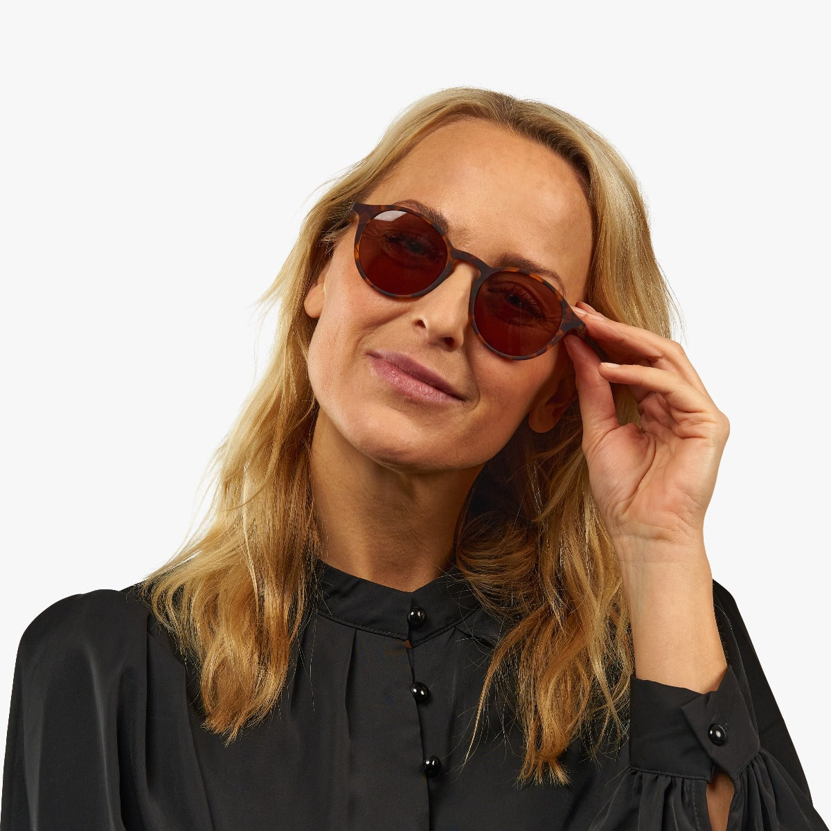 Person wearing Læsø Turtle tortoiseshell sunglasses