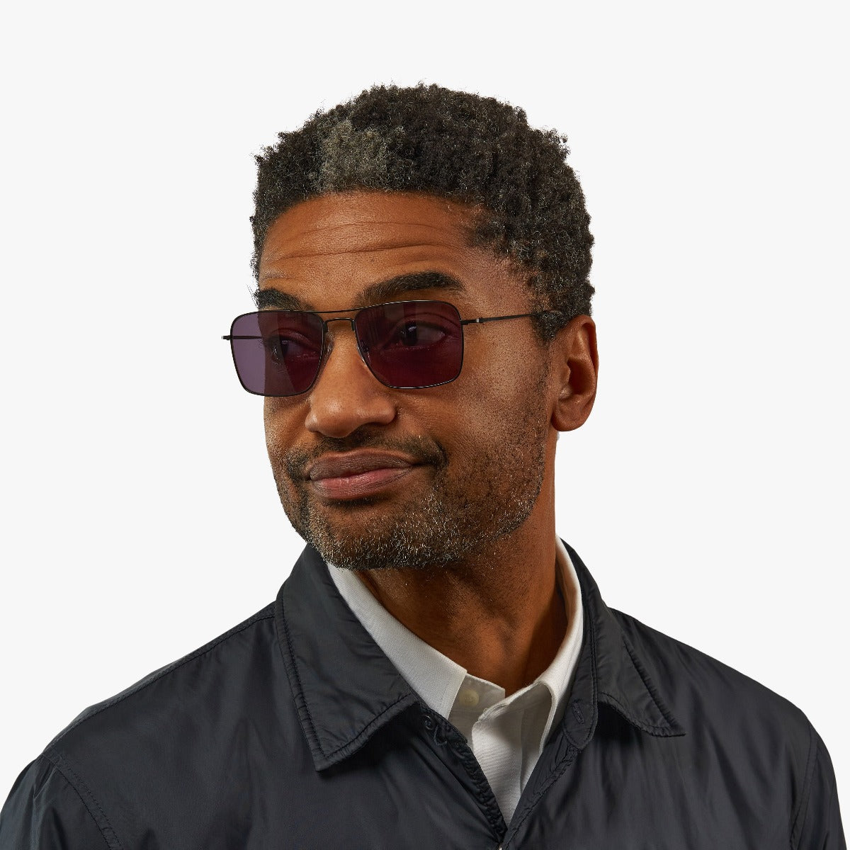 Person wearing Lidköping Black sunglasses with black frame