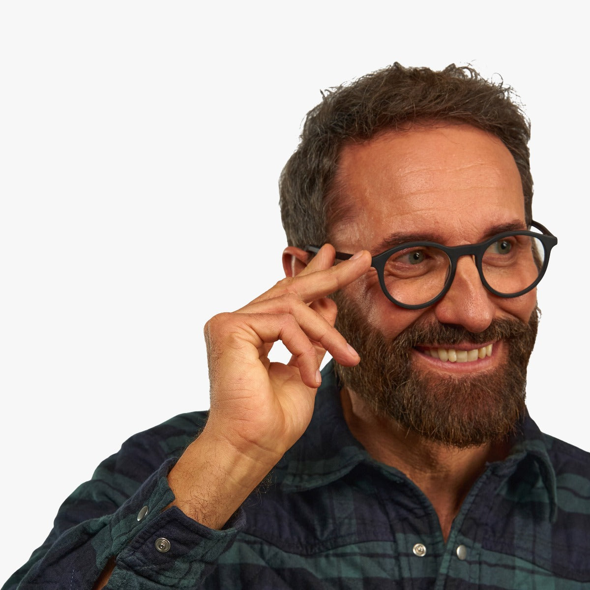 Person wearing Løkken Black round glasses with black frames