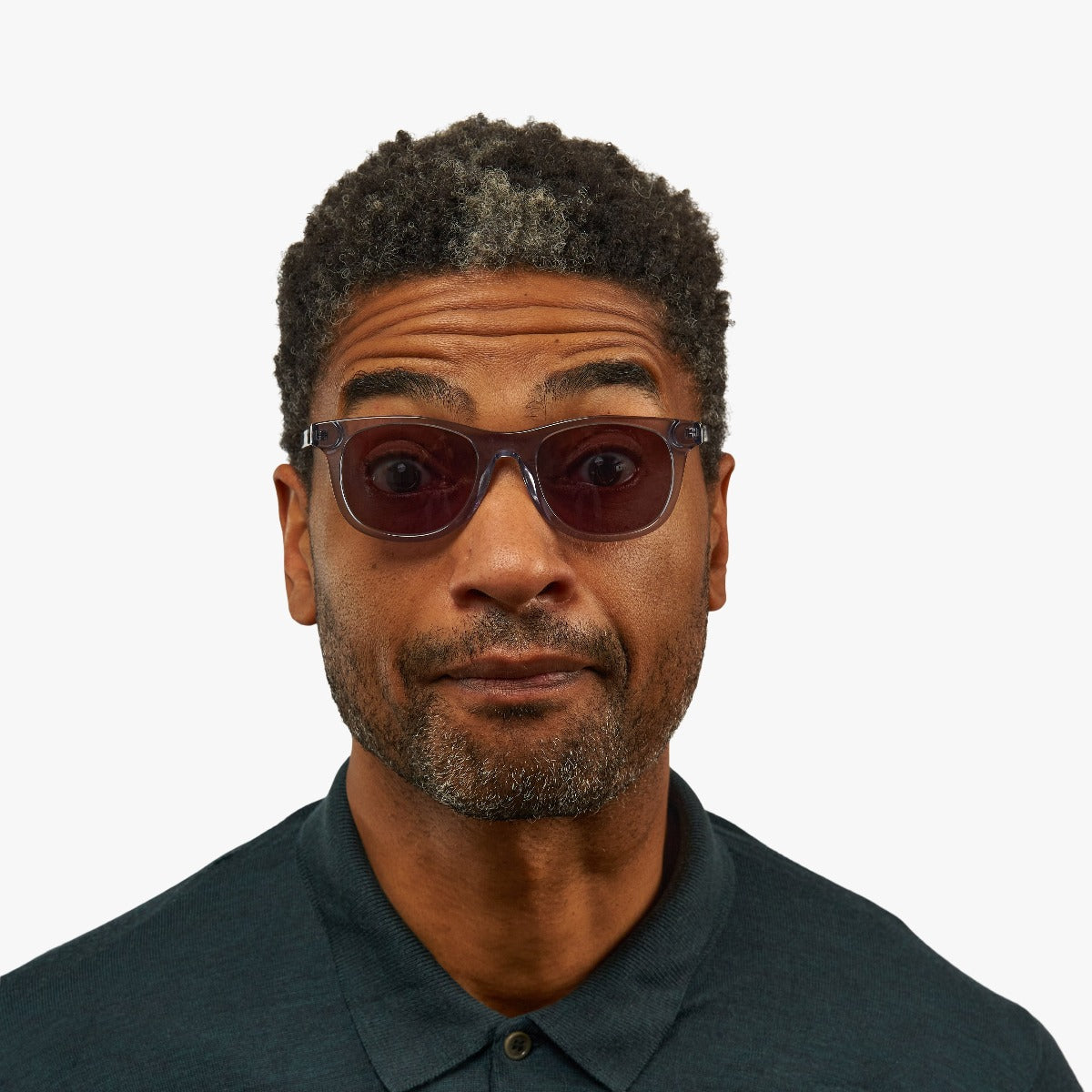 Person wearing Malmö Crystal Grey reading glasses