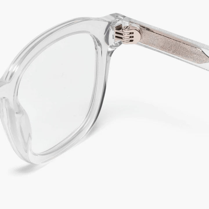 Detail of crystal white glasses with gold hinges