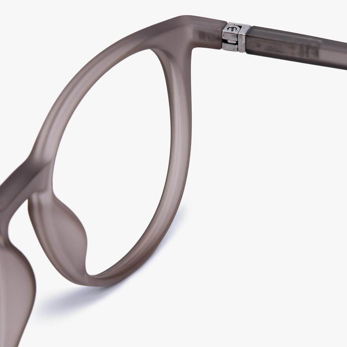 Close-up of Stockholm Grey round glasses with matte finish and metal hinge