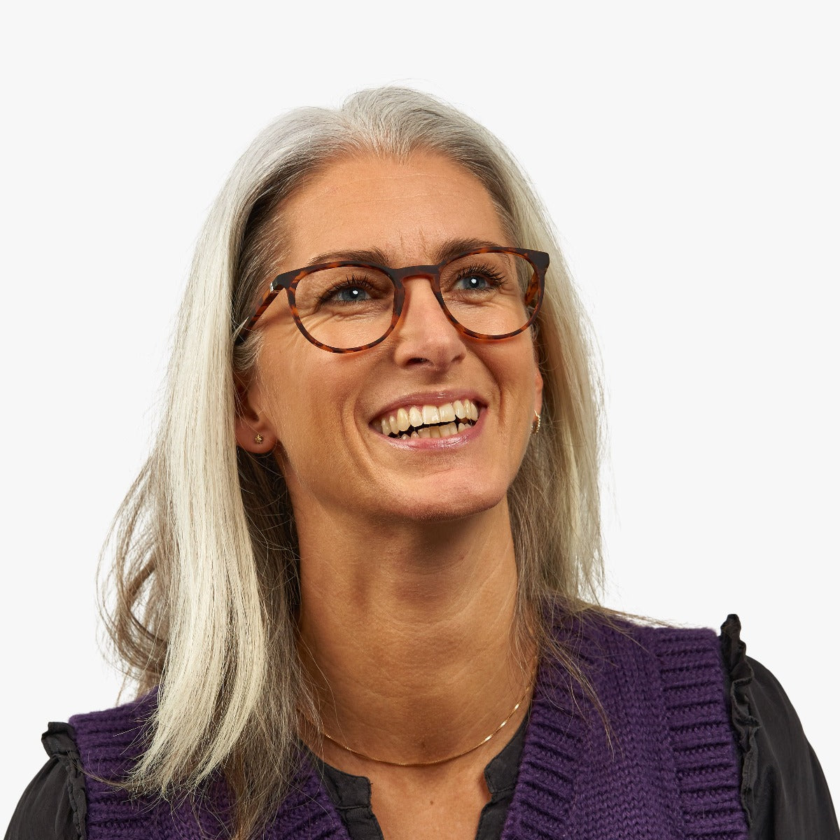 Person wearing tortoiseshell Stockholm Turtle glasses