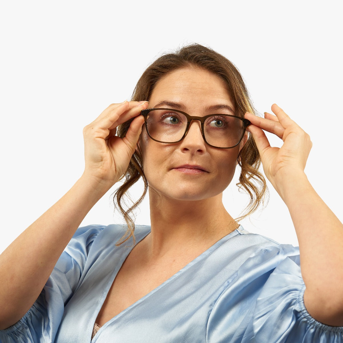 womens-ebeltoft-shiny-olive_blue-light-glasses_female-model-1.jpg?v=1771416986&width=1200