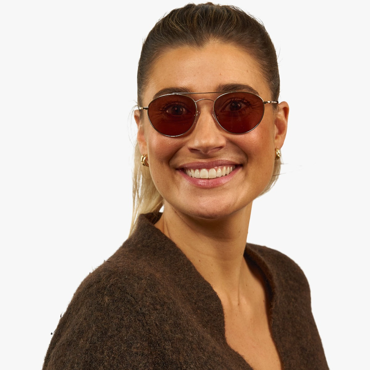 womens-goteborg-gold_sunglasses_female-model-1.jpg?v=1771416619&width=2597