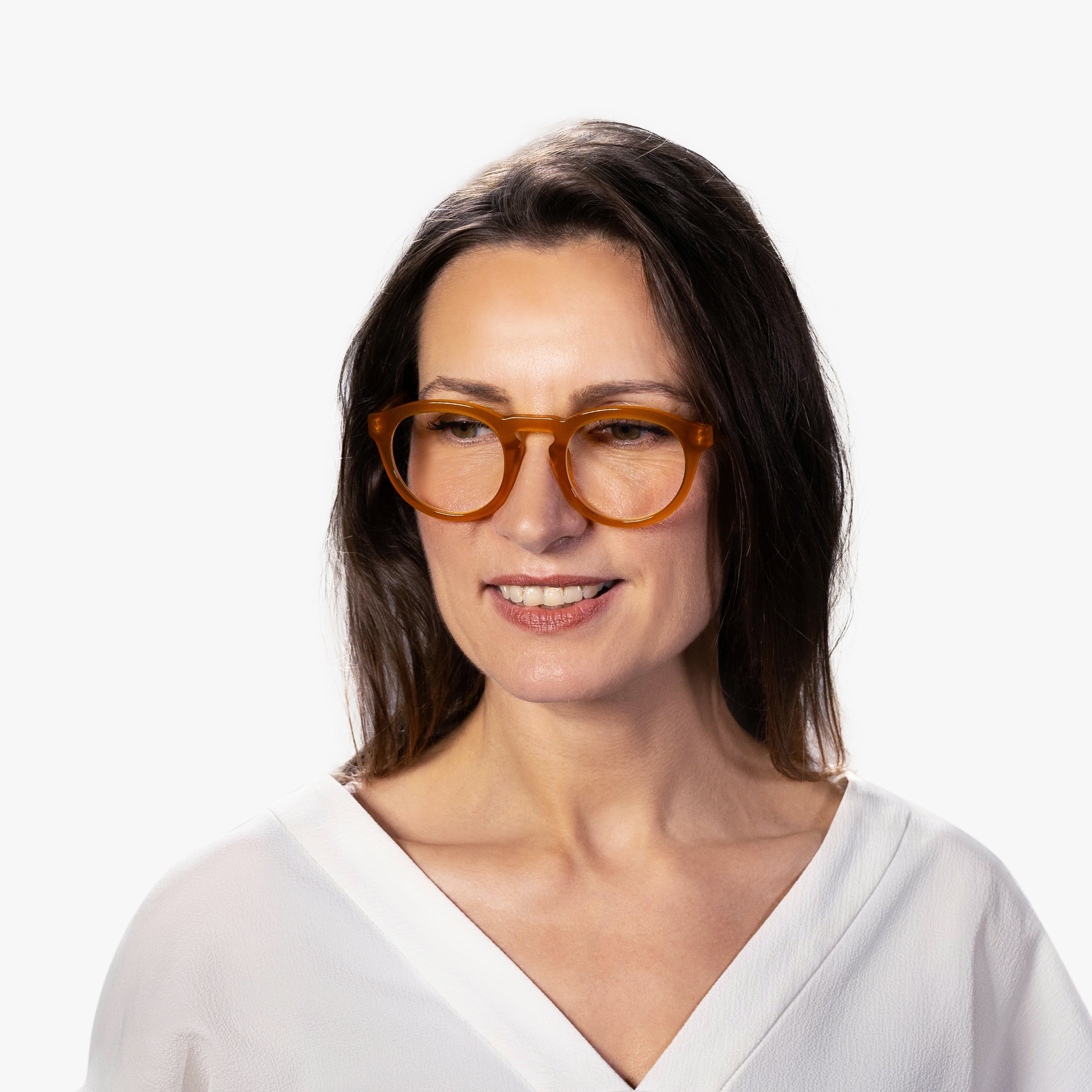 Person wearing honey-colored crystal reading glasses