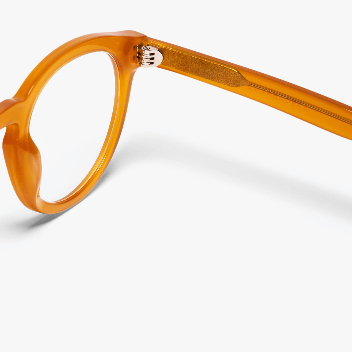 Crystal honey reading glasses with Luxreaders branding on temple