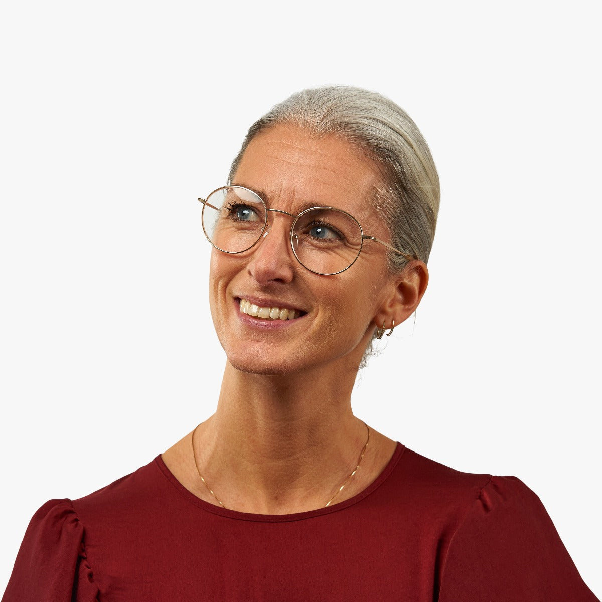 womens-tromso-gold_blue-light-glasses_female-model-1.jpg?v=1771418409&width=1200