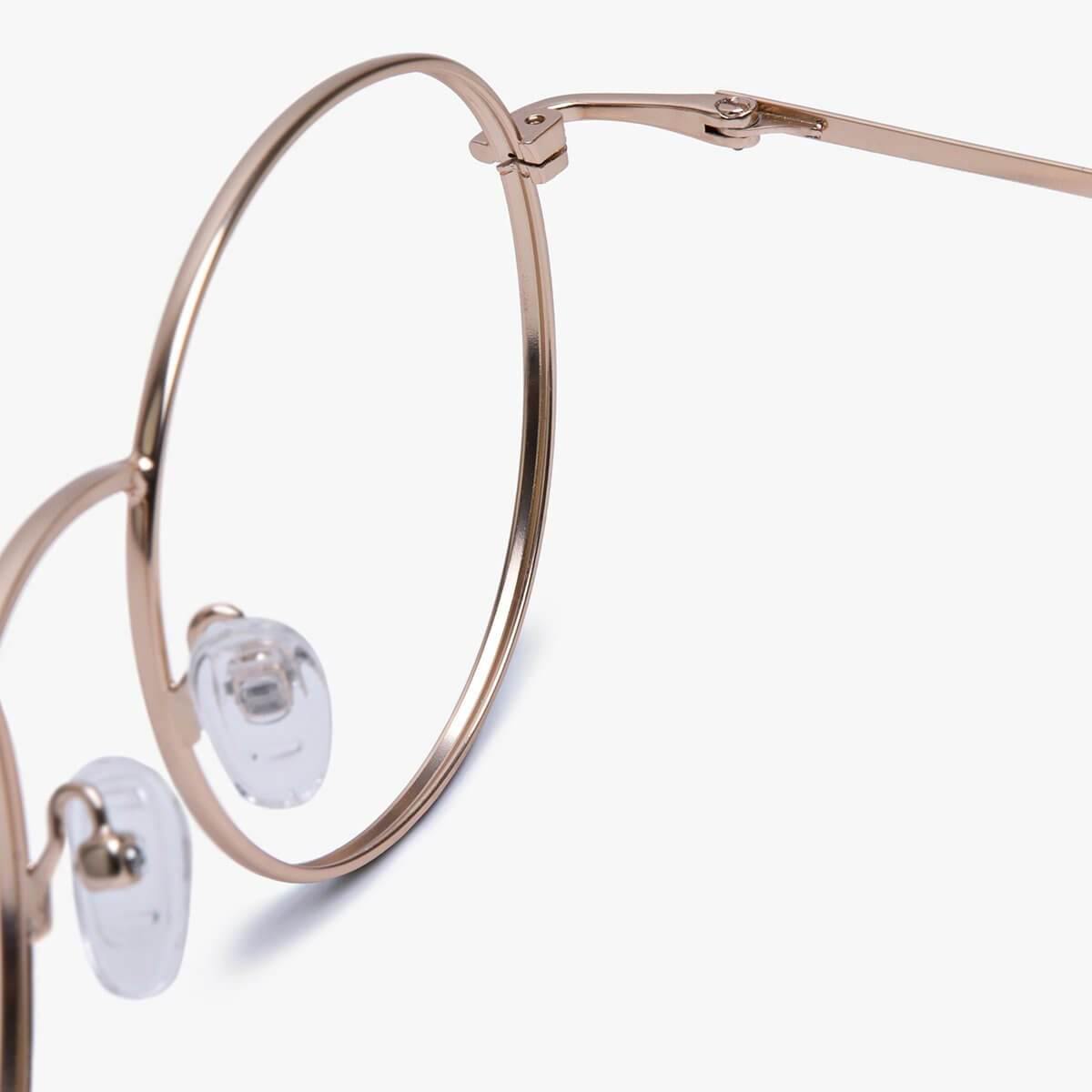 Close-up of Women's Tromsø Gold round glasses with gold frame and clear nose pads