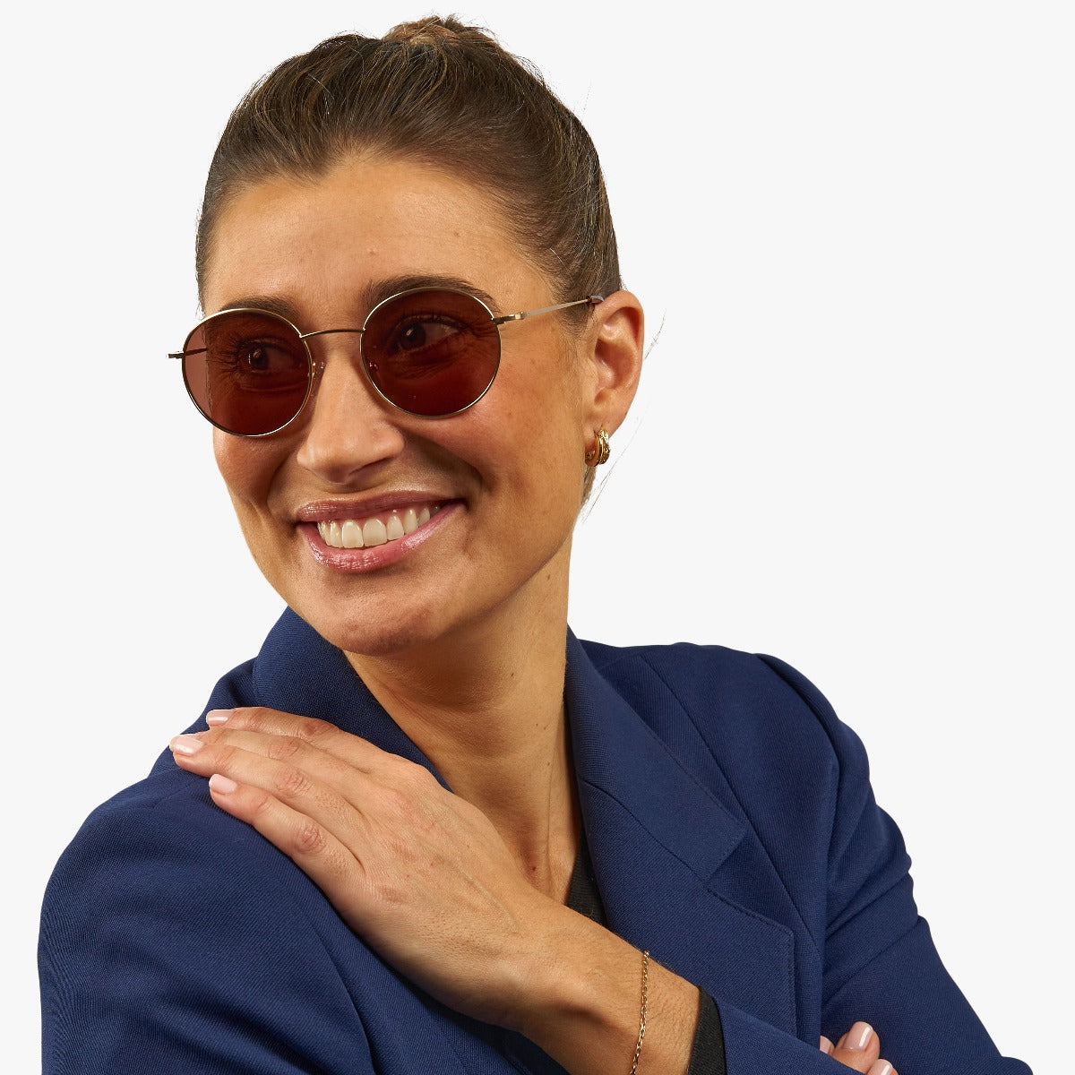 womens-tromso-gold_sunglasses_female-model-1.jpg?v=1771418365&width=1200